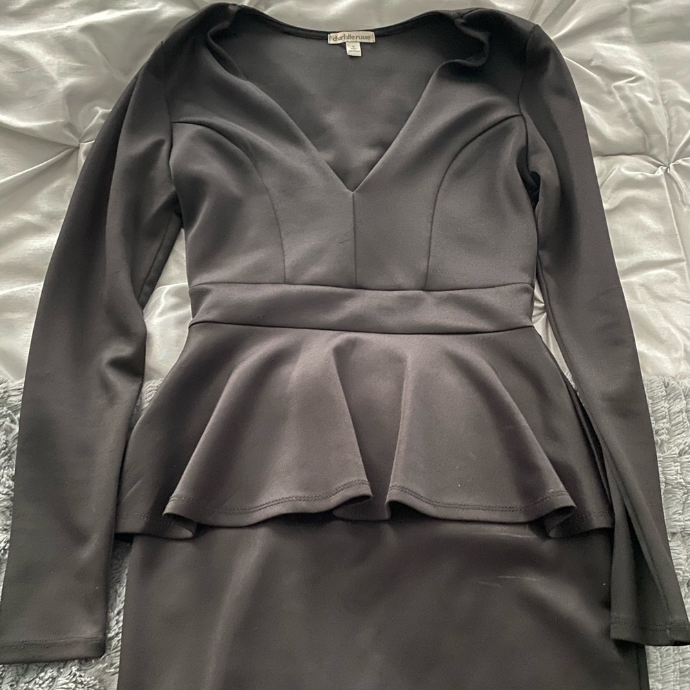 Form fitting tiered low cut black dress